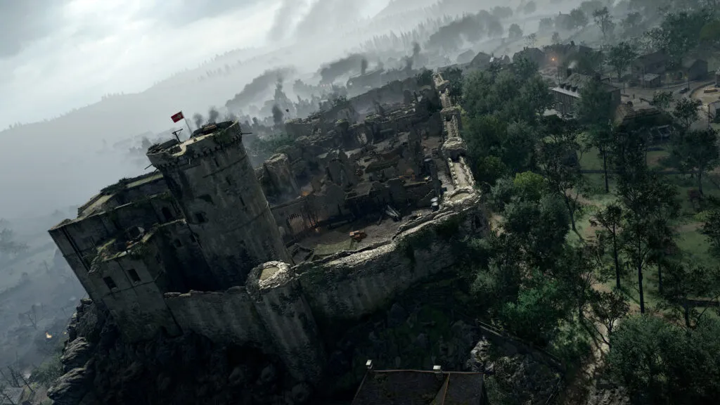 A castle and battlements sit on the edge of a cliff.