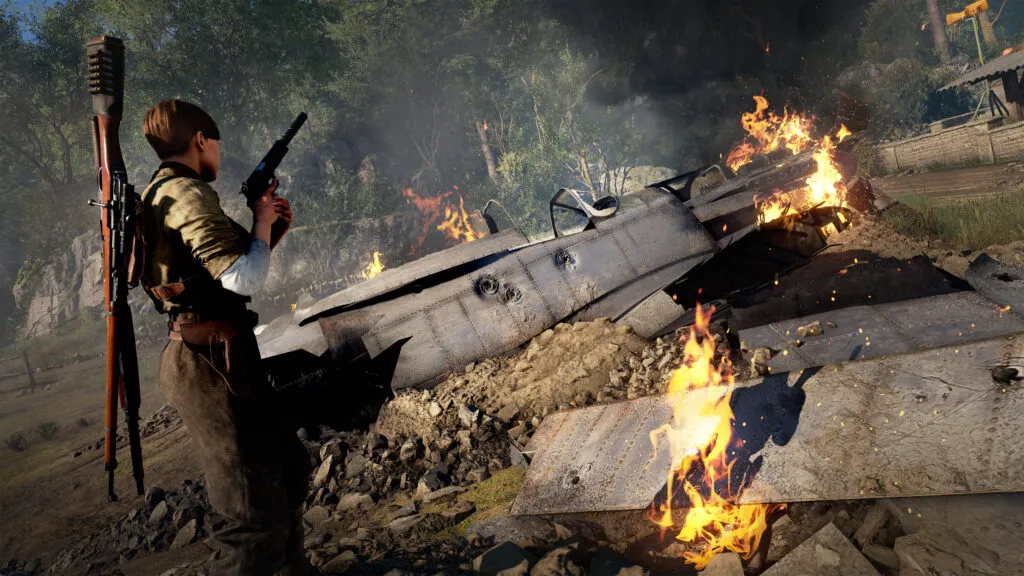A female soldier stands watching over a downed plane holding a silenced pistol.
